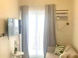 Cozy 1BR with Balcony, Sea View and Pool - Fast WiFi - Snug Sanctuary