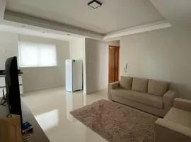 Apartamento em Poços - Varanda com Churrasqueira