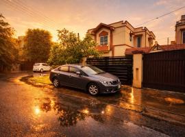 Haven Lodge Eden Lahore by Haven Holiday Homes - 4BR Spanish Villa with Lawn, BBQ, Hotel in Lahore
