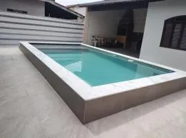 Casa piscina com ozônio churrasqueira perto da praia