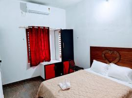 Flavoury Restaurant & Rooms, hotel sa Paithalmala