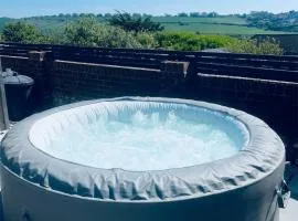 Studio Cabin Retreat with Hot Tub Sea and Downs views in Seaford with own garden