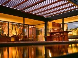 Wake up to nature in this modern glass house