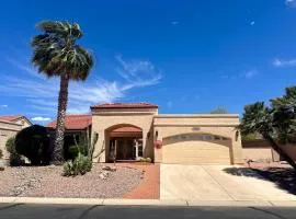 Mountain-view home with shaded patio, large yard, on-site golf & tennis