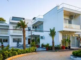 ELIVAAS AdhiVa 5-BHK Farmhouse with Private Pool, Bar & Lush Garden