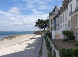 The feet in the sand - and town