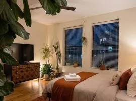 Sunlit Luxury 2BR Harlem Brownstone Retreat with Terrace Near Express Trains