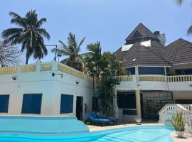 Luxurious 3-Bedroom Holiday House with Pool Access in Diani Beach
