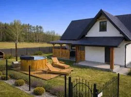 Całoroczny dom wypoczynkowy pod Lasem z prywatnym jaccuzii