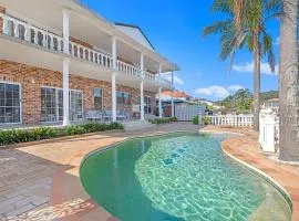 Stunning 4BR Holiday Home with Water Views & Pool