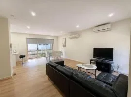 Spacious 4BR Townhouse with Parking Near Station