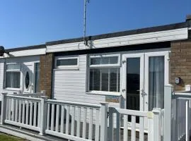 288, Two bed Chalet on Belle Aire Holiday Park - With private veranda, sleeps 5, pet friendly, free Wi-Fi, bed linen and towels included and onsite entertainment available