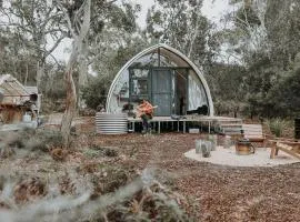 Numie White Gum Cocoon with Hot Tub Waterfront