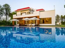 ELIVAAS Sanisa Farm 3-BHK Farmhouse with Pvt Pool, Game Zone & Lush Garden