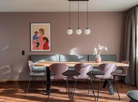 Julius Appartements & Zimmer โรงแรมในวาไกรน์