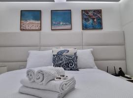 Conforto Pé na Areia com Jacuzzi Praia da Costa، فندق في فيلا فيلها