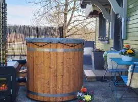 le chalet vert & bain nordique privatif Skadi au feu de bois