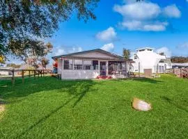 Lakefront home with water views, foosball, screened porch, & private W/D