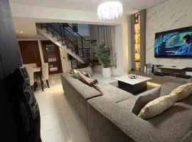 1 bedroom apartment with 24 hours power and Wi-Fi, elevator access, and a view of Coaster Road