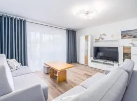 Seaside Breeze Stylish Apartment Balcony & Parking by Noclegi Renters