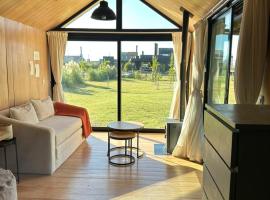 Tiny House Refugio Cálido para 2 personas con Parrilla โรงแรมในตันดิล