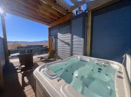 Immaculate townhome with a private rooftop hot tub walk to dining and nightlife