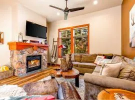 ski-in - ski-out condo with a deck ski views & a shared pool and hot tub