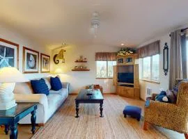 Coastal retreat steps from the beach with a nautical theme