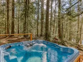 Rustic lodge with private hot tub fireplace & riverfront views - dog-friendly