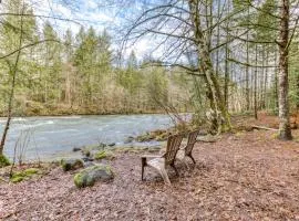 Historic riverfront Steiner cabin in forest with firepit deck & patio lounging