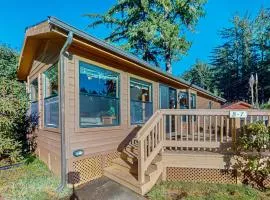 Cozy abode steps from the beach with a private hot tub and nautical theme