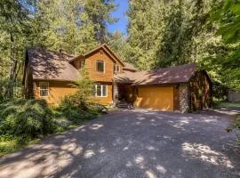 Classic riverfront home with great views game room hot tub & modern cabin feel