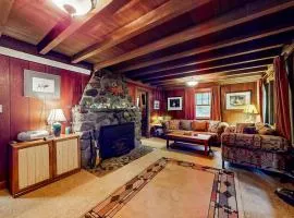 Unwind in nature's embrace at a 1925 cabin with hot tub & river views