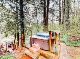 Unwind in nature's embrace at a 1925 cabin with hot tub & river views