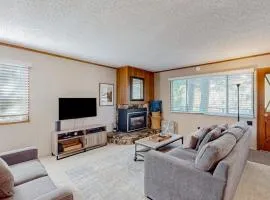 Classic central cabin near river with large tree-lined deck grassy yard & gym
