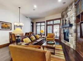 Ski-in-ski-out ground-floor condo with fireplace patio shared pool & hot tub