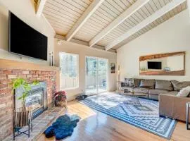 Two-story mountain-view condo with balcony fireplace & pool - dog-friendly