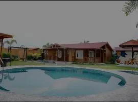 Arunam - A Royal Wooden Cottage & Pool Farmhouse