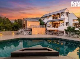 StayVista at The Ivory Courtyard with Pool & BBQ