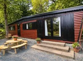 Neaum Crag Lodge ideal for a couple or family with young children in a woodland setting at Skelwith Bridge