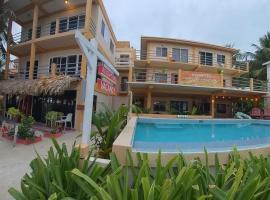 Beach Club Condos at Popeyes, hotel i Caye Caulker