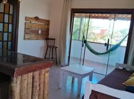 Rustic apartment with balcony and hammocks