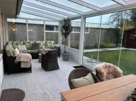Strandnahes Nr 156 Ferienhaus mit traumhaften Wintergarten und uneinsehbaren, grossen Garten, Eckgrundstück