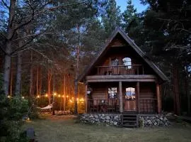 Mõnus palkmaja Muhu mändide all