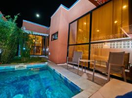 Résidence Akia - Jacuzzi privé & détente moderne, hôtel à Pointe-Noire