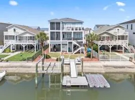 Doin` Time Canal Front home with elevator and extra living room