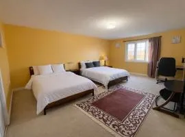 Spacious Two-Bed Suite with Private Bath, Walk-In Closet & Mini Fridge! Brampton Shared Home with 4 Baths, Full Kitchen & Laundry! Near Mount Pleasant GO, Ideal for Work Trips, Long Stays & Solo Travelers!