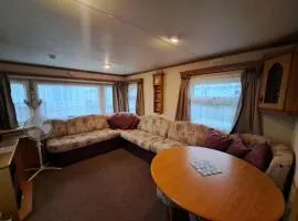 Plum 3 a luxury 2 bed 6 berth static caravan, bedding included, secure veranda with ramped access on Coral Beach in Ingoldmells