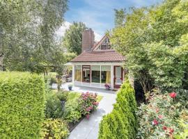 Kleine Karekiet I Vakantiehuis met ruime tuin, ξενοδοχείο σε Zwiggelte