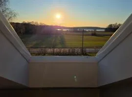 Attic floor with views over fields and sea